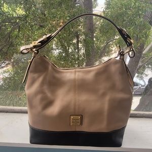 Tan leather purse with red leather lining